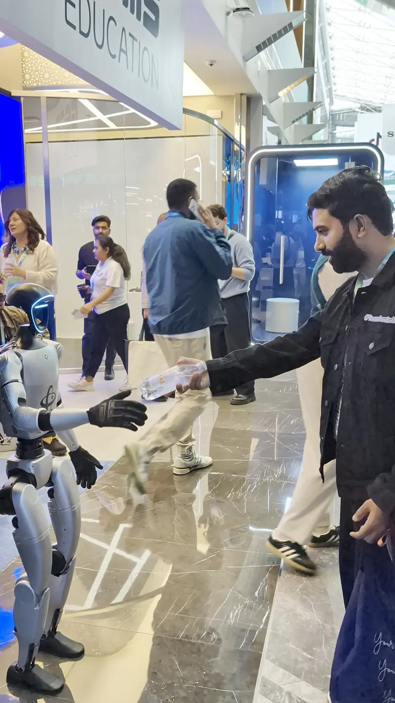 Shaking hands with a humanoid robot on the expo floor