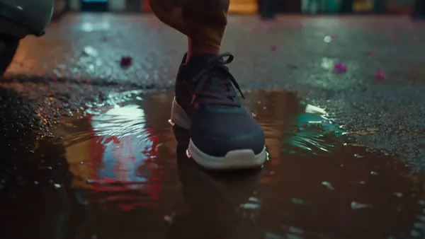 Zipgo - Wet-street sneaker spot, night reflections